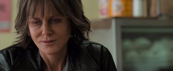 Movie still from “Destroyer” (2018), directed by Karyn Kusama – A person wearing a leather jacket; Close Up shot, Over the shoulder angle