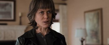 Movie still from “Destroyer” (2018), directed by Karyn Kusama – A person with short hair; Close Up shot, Over the shoulder angle