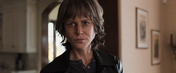 Movie still from “Destroyer” (2018), directed by Karyn Kusama – A person wearing a leather jacket; Close Up shot, Low angle
