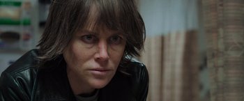 Movie still from “Destroyer” (2018), directed by Karyn Kusama – A person wearing a leather jacket; Close Up shot, Over the shoulder angle