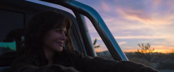 Movie still from “Destroyer” (2018), directed by Karyn Kusama – A woman sitting in the driver's seat of a car; Close Up shot, Low angle