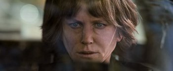 Movie still from “Destroyer” (2018), directed by Karyn Kusama – A woman's face looking at the camera; Close Up shot, Low angle