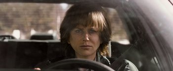 Movie still from “Destroyer” (2018), directed by Karyn Kusama – A woman sitting in the drivers seat of a car; Close Up shot, Over the shoulder angle