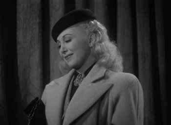 Movie still from “Detour” (1945), directed by Edgar G. Ulmer – A black and white photo of a woman wearing a hat; Close Up shot, Low angle