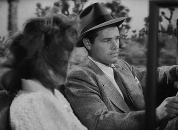Movie still from “Detour” (1945), directed by Edgar G. Ulmer – A black and white photo of a man and a woman; Close Up shot, Low angle