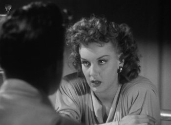 Movie still from “Detour” (1945), directed by Edgar G. Ulmer – A woman sitting at a table looking at another woman; Close Up shot, Over the shoulder angle