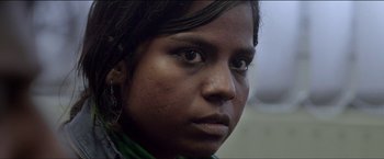 Movie still from “Dheepan” (2015), directed by Jacques Audiard – A young woman's face; Close Up shot, Low angle