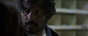 Movie still from “Dheepan” (2015), directed by Jacques Audiard – A person with a beard; Close Up shot, Over the shoulder angle