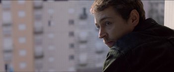 Movie still from “Dheepan” (2015), directed by Jacques Audiard – A person looking at the camera; Close Up shot, Over the shoulder angle