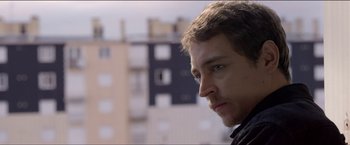 Movie still from “Dheepan” (2015), directed by Jacques Audiard – A person looking at the camera; Close Up shot, Over the shoulder angle