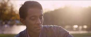 Movie still from “Dheepan” (2015), directed by Jacques Audiard – A person with his eyes closed; Close Up shot, Low angle