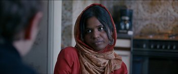 Movie still from “Dheepan” (2015), directed by Jacques Audiard – A person wearing a scarf; Close Up shot, Low angle