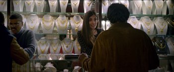 Movie still from “Dheepan” (2015), directed by Jacques Audiard – A woman talking to a man in a jewelry store; Close Up shot, Over the shoulder angle