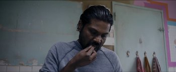 Movie still from “Dheepan” (2015), directed by Jacques Audiard – A person brushing his teeth; Close Up shot, High angle