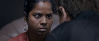 Movie still from “Dheepan” (2015), directed by Jacques Audiard – A person looking at the camera; Close Up shot, Over the shoulder angle