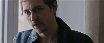 Movie still from “Dheepan” (2015), directed by Jacques Audiard – A person wearing a jacket; Close Up shot, Over the shoulder angle