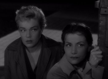 Movie still from “Diabolique” (1955), directed by Henri-Georges Clouzot – A couple of women sitting next to each other in a room; Close Up shot, High angle