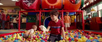 Movie still from “Diary of a Wimpy Kid: The Long Haul” (2017), directed by David Bowers – A group of kids playing in a ball pit; Medium shot, High angle