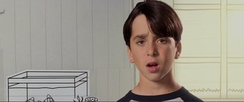 Movie still from “Diary of a Wimpy Kid: The Long Haul” (2017), directed by David Bowers – A young boy with a surprised look on his face; Close Up shot, Low angle