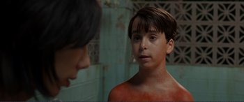 Movie still from “Diary of a Wimpy Kid: The Long Haul” (2017), directed by David Bowers – A young boy is looking at a woman; Close Up shot, High angle
