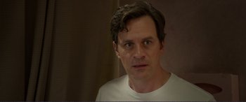 Movie still from “Diary of a Wimpy Kid: The Long Haul” (2017), directed by David Bowers – A person wearing a white t - shirt; Close Up shot, Over the shoulder angle