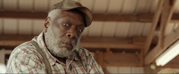 Movie still from “Diary of a Wimpy Kid: The Long Haul” (2017), directed by David Bowers – An older man wearing a hat and a plaid shirt; Close Up shot, Over the shoulder angle