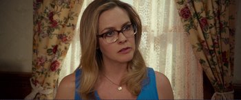 Movie still from “Diary of a Wimpy Kid: The Long Haul” (2017), directed by David Bowers – A person wearing glasses and a necklace; Close Up shot, Over the shoulder angle