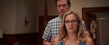 Movie still from “Diary of a Wimpy Kid: The Long Haul” (2017), directed by David Bowers – A man and a woman standing next to each other; Close Up shot, Over the shoulder angle