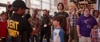 Movie still from “Diary of a Wimpy Kid: The Long Haul” (2017), directed by David Bowers – A group of people standing in a room; Medium shot, Over the shoulder angle