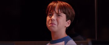 Movie still from “Diary of a Wimpy Kid: The Long Haul” (2017), directed by David Bowers – A young boy with a sad look on his face; Close Up shot, Low angle