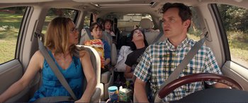 Movie still from “Diary of a Wimpy Kid: The Long Haul” (2017), directed by David Bowers – A group of people sitting in the back of a car; Medium shot, Over the shoulder angle