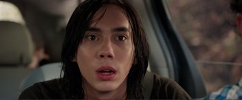 Movie still from “Diary of a Wimpy Kid: The Long Haul” (2017), directed by David Bowers – A person with long black hair; Close Up shot, High angle