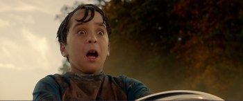 Movie still from “Diary of a Wimpy Kid: The Long Haul” (2017), directed by David Bowers – A young boy with a surprised look on his face; Close Up shot, Low angle