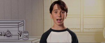 Movie still from “Diary of a Wimpy Kid: The Long Haul” (2017), directed by David Bowers – A young boy with a surprised look on his face; Close Up shot, Overhead angle