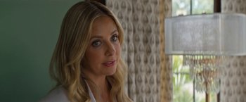 Movie still from “Do Revenge” (2022), directed by Jennifer Kaytin Robinson – A person with long blonde hair; Close Up shot, Over the shoulder angle