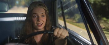 Movie still from “Do Revenge” (2022), directed by Jennifer Kaytin Robinson – A woman sitting in the driver's seat of a car; Close Up shot, Over the shoulder angle
