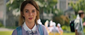Movie still from “Do Revenge” (2022), directed by Jennifer Kaytin Robinson – A girl with a bow tie is standing in a park; Close Up shot, Over the shoulder angle