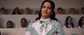 Movie still from “Do Revenge” (2022), directed by Jennifer Kaytin Robinson – A man in a green bow tie and a white shirt; Close Up shot, Low angle