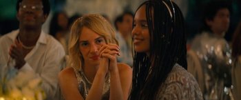 Movie still from “Do Revenge” (2022), directed by Jennifer Kaytin Robinson – Two women sitting next to each other in a room; Close Up shot, Over the shoulder angle