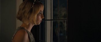 Movie still from “Do Revenge” (2022), directed by Jennifer Kaytin Robinson – A woman looking out of a window at night; Close Up shot, Over the shoulder angle