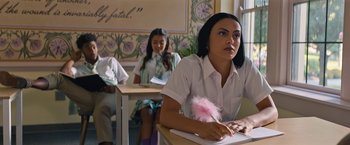 Movie still from “Do Revenge” (2022), directed by Jennifer Kaytin Robinson – A woman sitting at a desk in front of a laptop; Medium shot, Over the shoulder angle