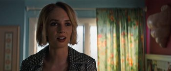 Movie still from “Do Revenge” (2022), directed by Jennifer Kaytin Robinson – A person wearing a jacket; Close Up shot, Over the shoulder angle