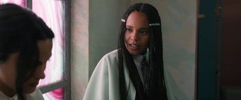 Movie still from “Do Revenge” (2022), directed by Jennifer Kaytin Robinson – A woman with long braids wearing a white robe; Close Up shot, Over the shoulder angle