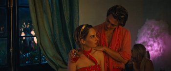 Movie still from “Do Revenge” (2022), directed by Jennifer Kaytin Robinson – A man and a woman in a red dress; Medium shot, Over the shoulder angle
