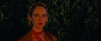 Movie still from “Do Revenge” (2022), directed by Jennifer Kaytin Robinson – A person wearing a necklace; Close Up shot, Over the shoulder angle