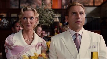 Movie still from “Dinner for Schmucks” (2010), directed by Jay Roach – A man and a woman dressed in white standing next to each other; Close Up shot, Low angle
