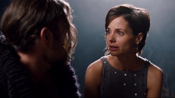 Movie still from “Dinner for Schmucks” (2010), directed by Jay Roach – A woman in a gray dress talking to a man in a gray dress; Close Up shot, Over the shoulder angle