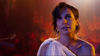 Movie still from “Dinner for Schmucks” (2010), directed by Jay Roach – A woman in a white dress looking to her left; Close Up shot, Over the shoulder angle