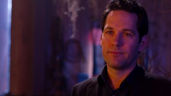 Movie still from “Dinner for Schmucks” (2010), directed by Jay Roach – A person wearing a suit and tie; Close Up shot, Over the shoulder angle