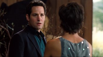 Movie still from “Dinner for Schmucks” (2010), directed by Jay Roach – A man and a woman standing next to each other; Close Up shot, Over the shoulder angle